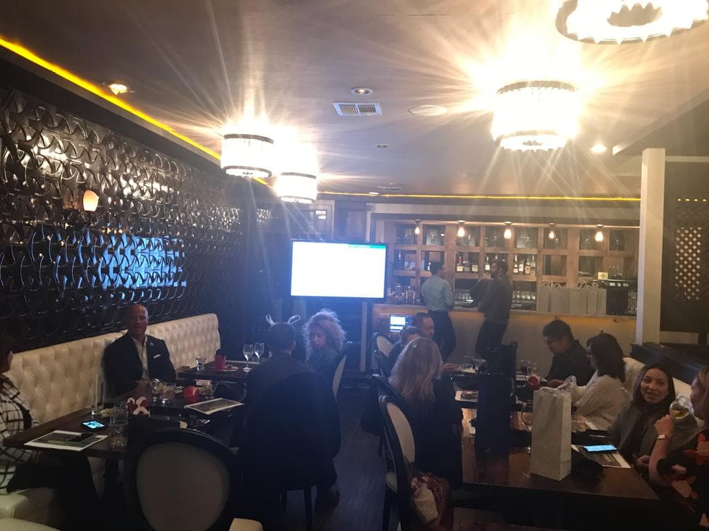 Bidraves team celebrating success in Los Angeles